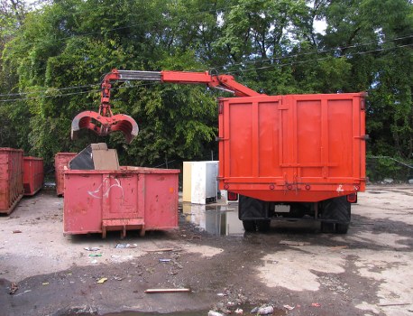 Skip hire truck and containers near Redbridge area