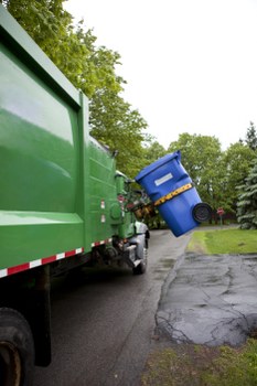 Workers sorting recyclable materials for effective waste management